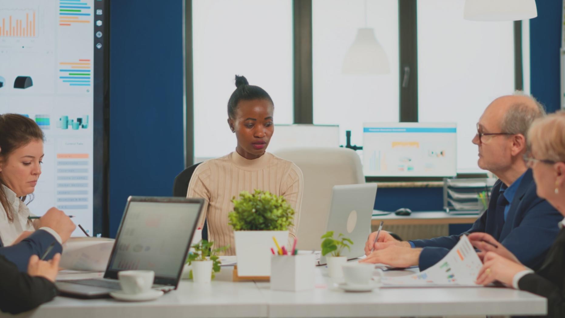 Financial data analysis and research materials spread on desk